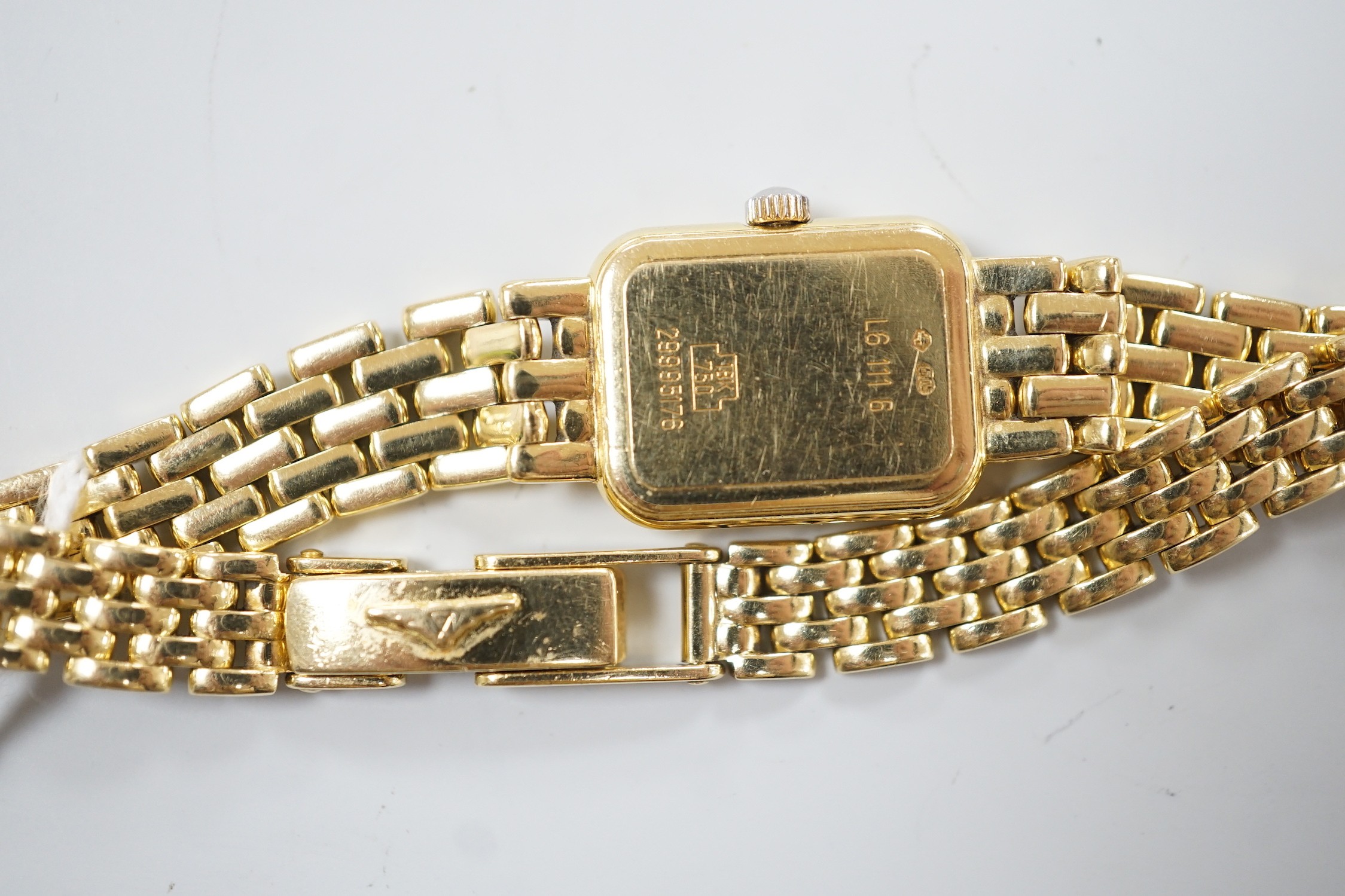 A lady's 2001 18ct gold Longines quartz wrist watch, with rectangular part Roman dial, on 18ct gold Longines bracelet, with original receipt and papers, no box